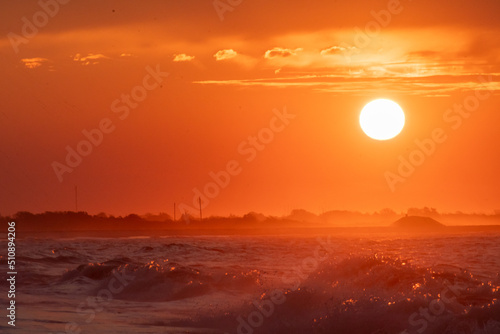 Ocean waves at sunrise off the shore of Cape May   New Jersey USA