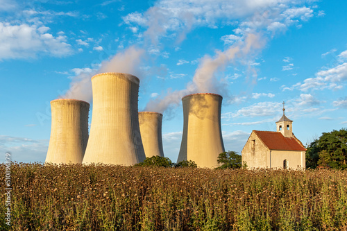 Old abandoned chapel and cooling towers of Dukovany Nuclear Power Station, Czech Republic