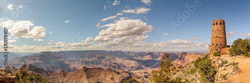 Panoramic views from the rim of Grand Canyon in Arizona, USA. Stunning tourism tourist area in panorama view with blue sky, clouds. 