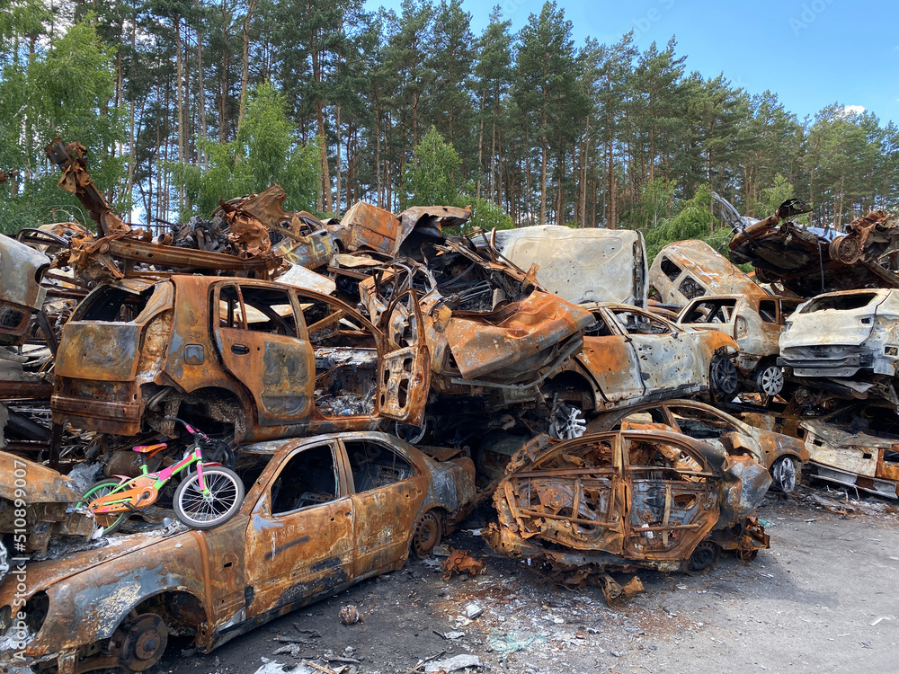 Shooting civilians. A war crime. Cemetery of cars.