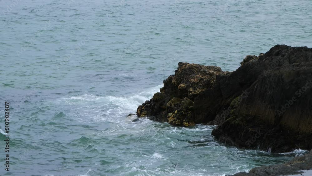 Sea waves break on the coastal rocks. Waters of the Atlantic Ocean. Seascape. Handheld video. Sea waves break on the coastal rocks. Waters of the Atlantic Ocean. Seascape. Handheld video.