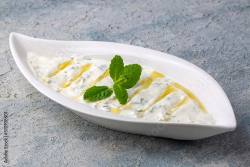 Haydari is a type of yogurt made from certain herbs and spices, combined with garlic. Turkish cuisine.