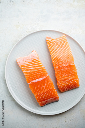 Fresh salmon fillet on a plate for delicious salmon steak.