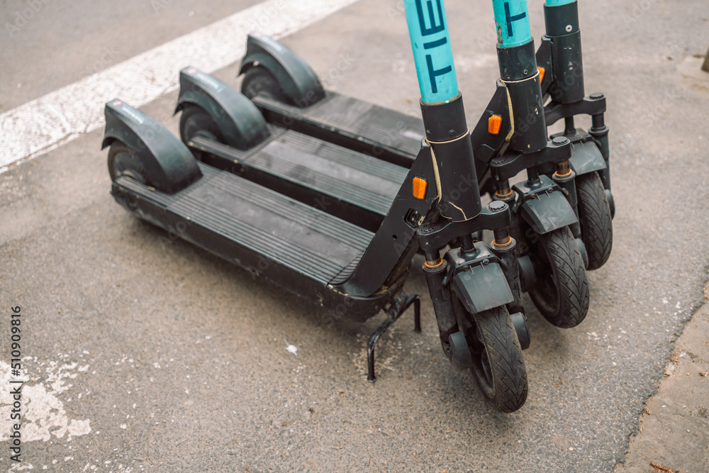 electric scooter on the road front view in park in summer electric scooter on the road front view in park in summer