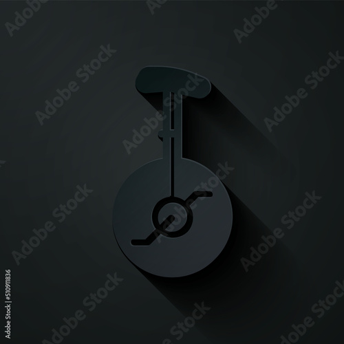 Paper cut Unicycle or one wheel bicycle icon isolated on black background. Monowheel bicycle. Paper art style. Vector
