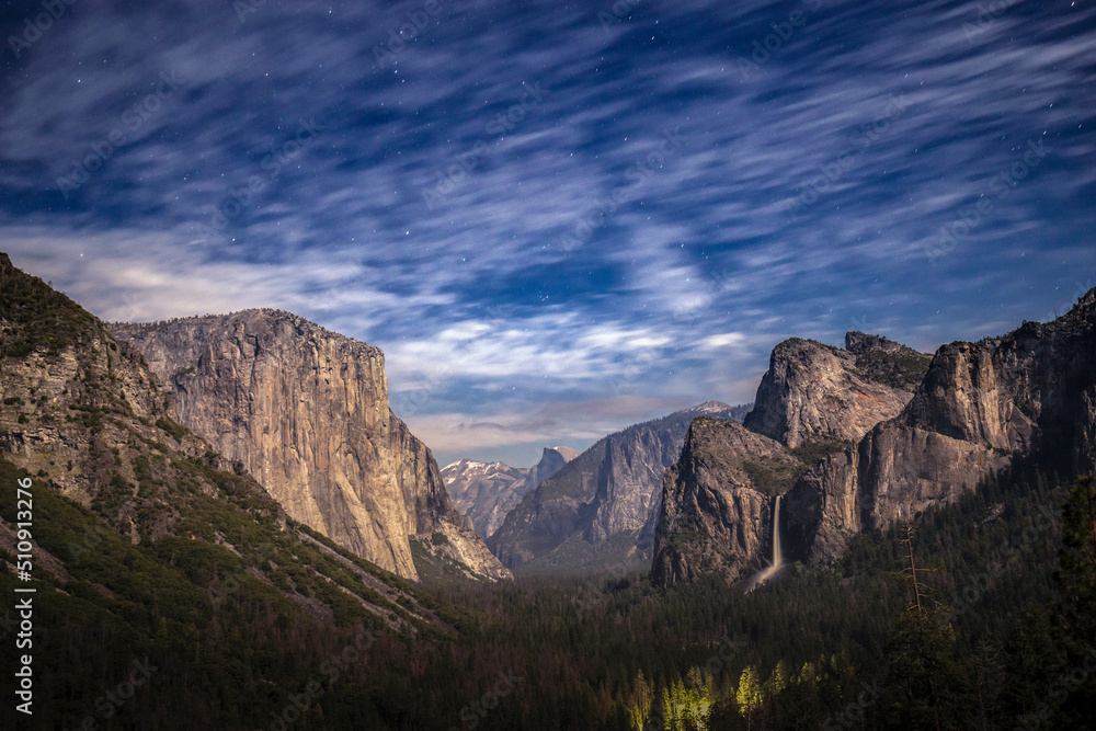 Yosemite valley as seen from Tunnel View during a full moon night with passing clouds, CA, USA