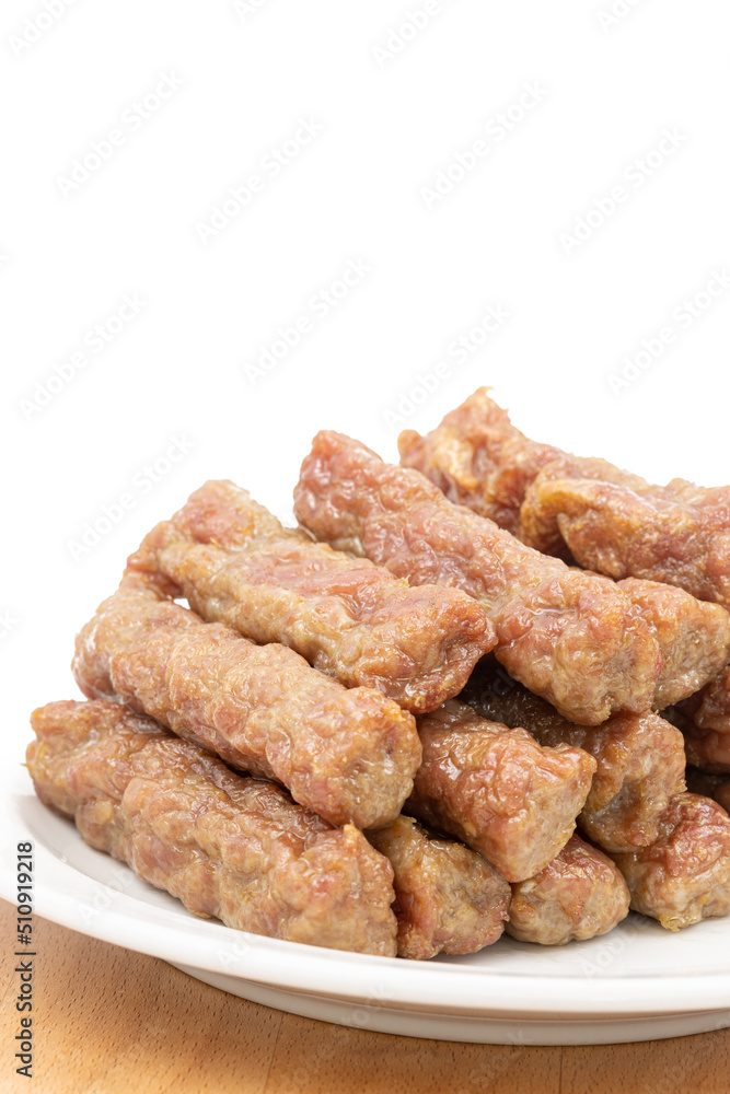Meat kebabs on the plate with copy space above white background Meat kebabs on the plate with copy space above white background