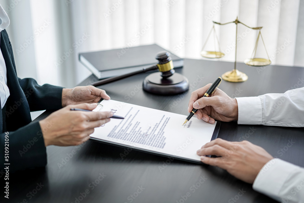 Male lawyer or notary working consulting and discussion to businesswoman client in the office, Law and Legal services concept Male lawyer or notary working consulting and discussion to businesswoman client in the office, Law and Legal services concept