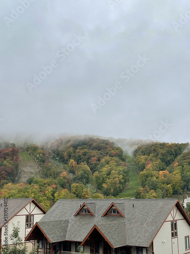 mountain view on a foggy autumn day from a village