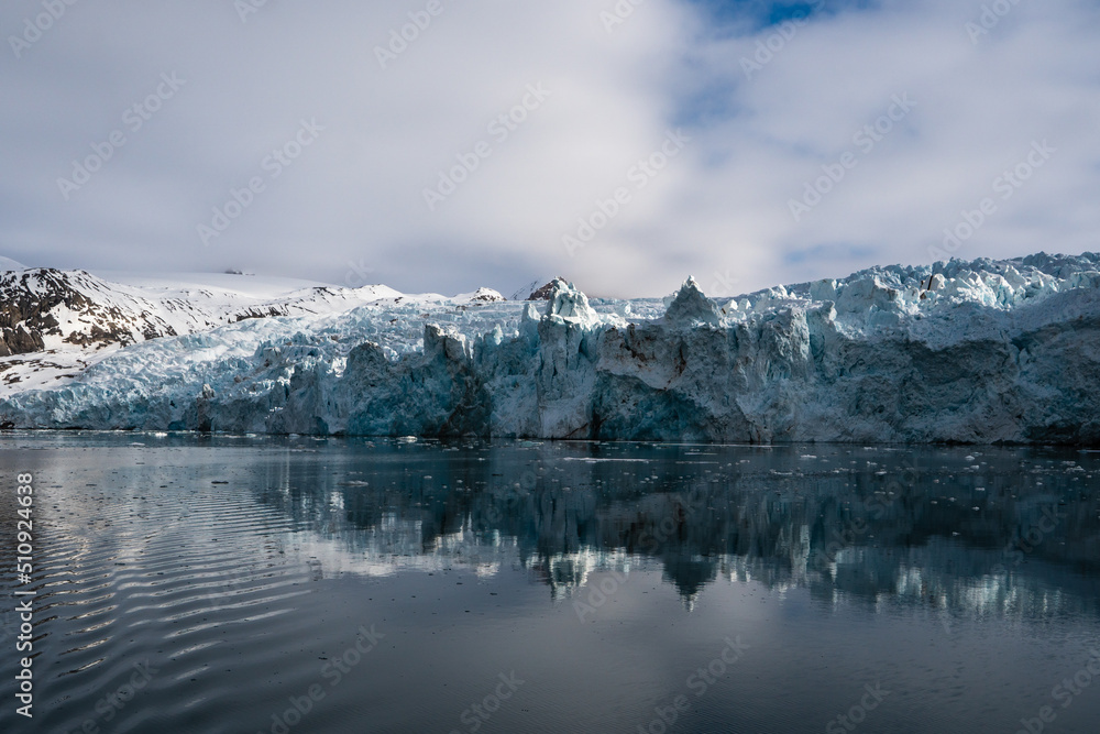 Melting glacier in Svalbard, Norway. Blue glacier ice.