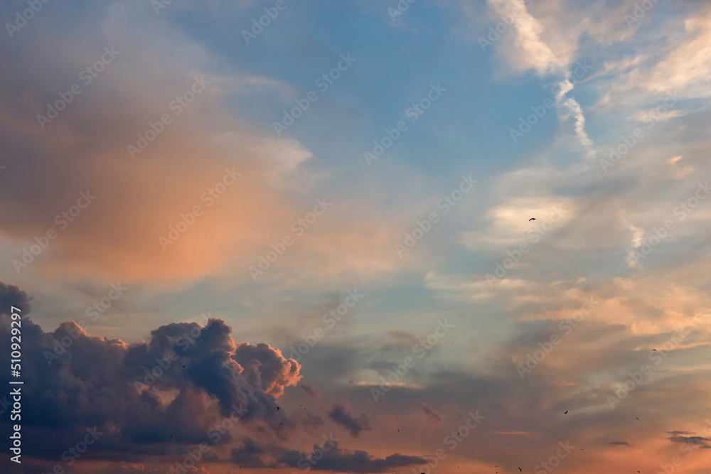The sky with clouds at sunset.   Thick clouds and the rich color of the sunset sky create an incredibly dramatic picture.