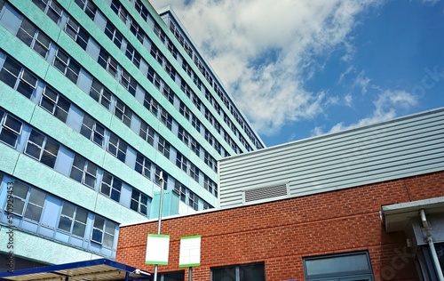 looking up at modern office or hospital building with sky
