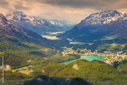 Saint Moritz and upper Engadine lakes from above with dramatic sky – Switzerland