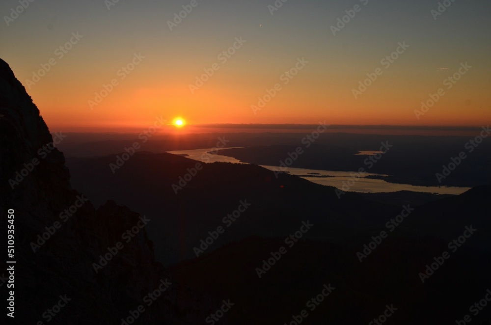 sunset over zurich. Beautiful sunset over lake zurich observed from the swiss mountains. High quality photo