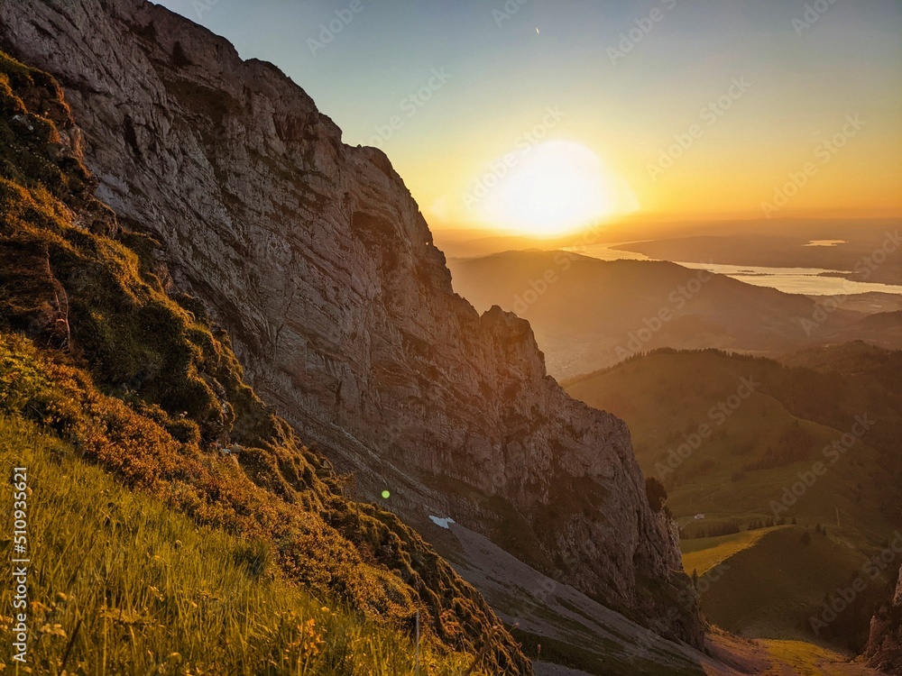 Breathtaking sunset in the mountains. View of the Bockmattli Innerthal and Lake Zurich. Hiking in Switzerland. Glarus