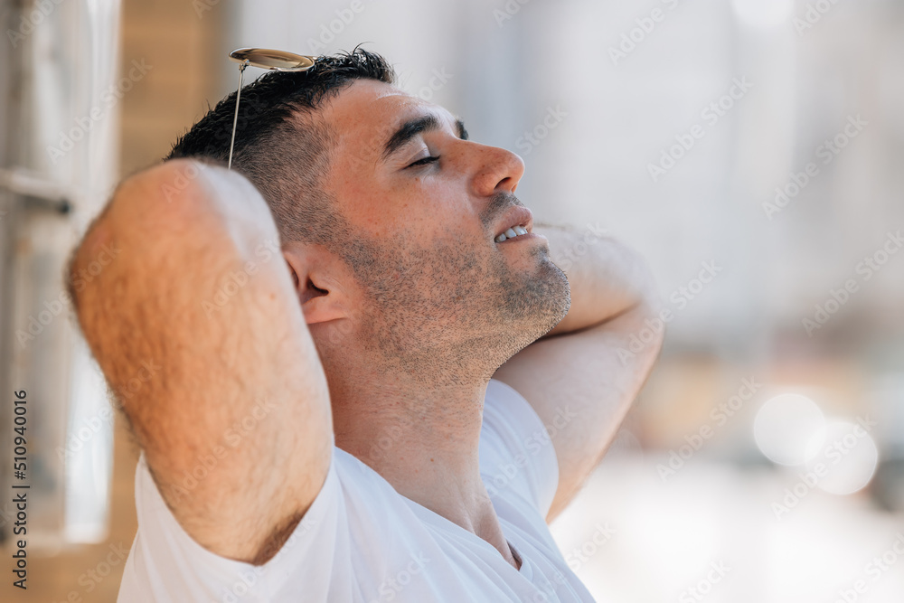Obraz premium man breathing relaxed outdoors in summer