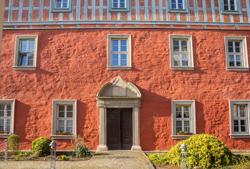 Naklejka premium Red facade of a historic house in Aschersleben, Germany