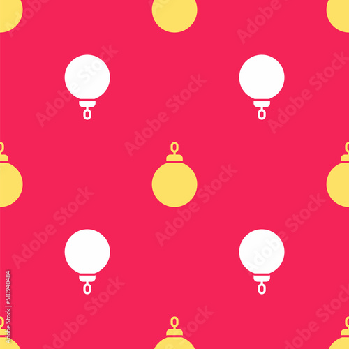 Yellow Christmas ball icon isolated seamless pattern on red background. Merry Christmas and Happy New Year. Vector