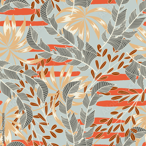 Abstract seamless tropical pattern with bright plants and leaves on a gray ba...