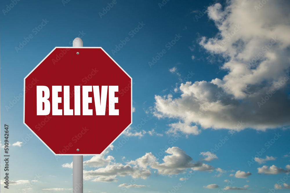 Obraz premium Red stop sign with the word Believe on a blue sky background.