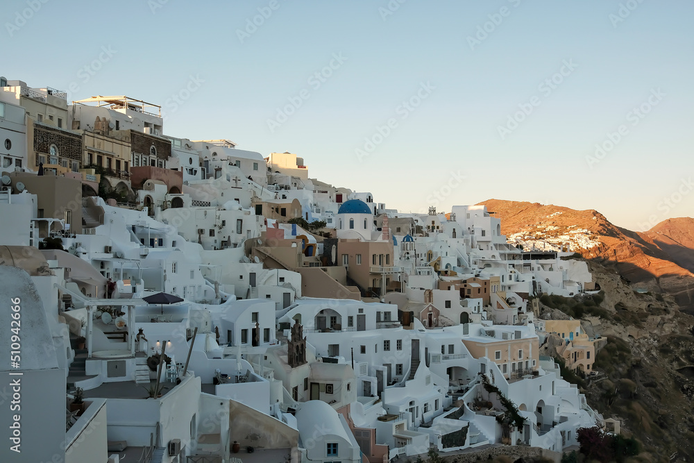 View of the whitewashed and picturesque small houses and hotels of Oia Santorini