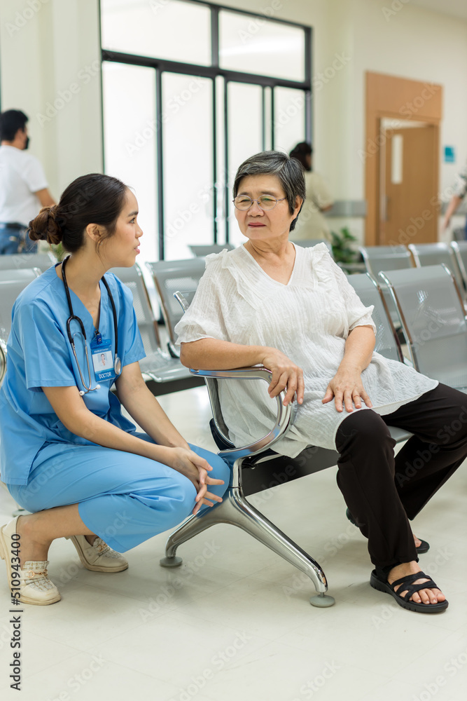 Nurse take care Elderly patient in hospital ward. Elderly woman sit down at hospital. Senior woman at hospital for a check-up Nurse take care Elderly patient in hospital ward. Elderly woman sit down at hospital. Senior woman at hospital for a check-up