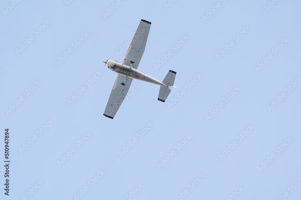light-engine aircraft against a backdrop of blue skies at sunset light-engine aircraft against a backdrop of blue skies at sunset