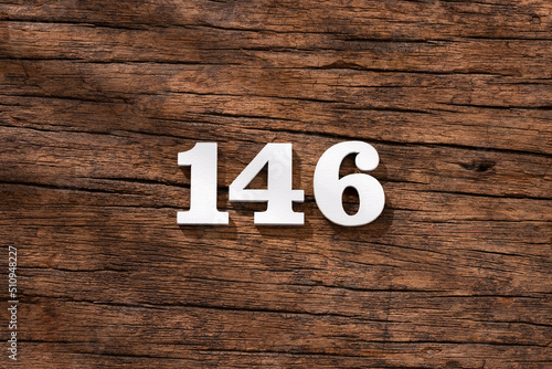 Number 146 - piece on rustic wood background