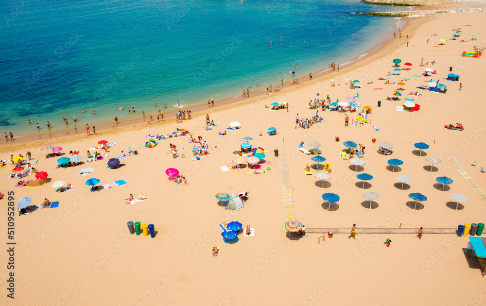 panorama of a sunny and colorful beach in Ericeira, Portugal