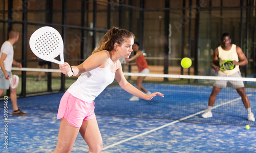 Athletic woman with passion plays padel © JackF