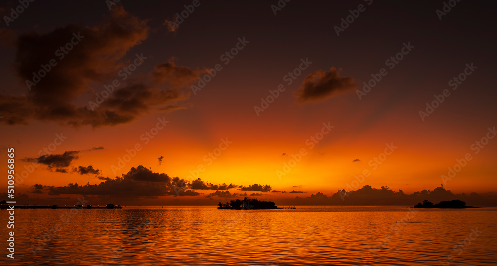 Sunset on Maldives paradise island holiday resort