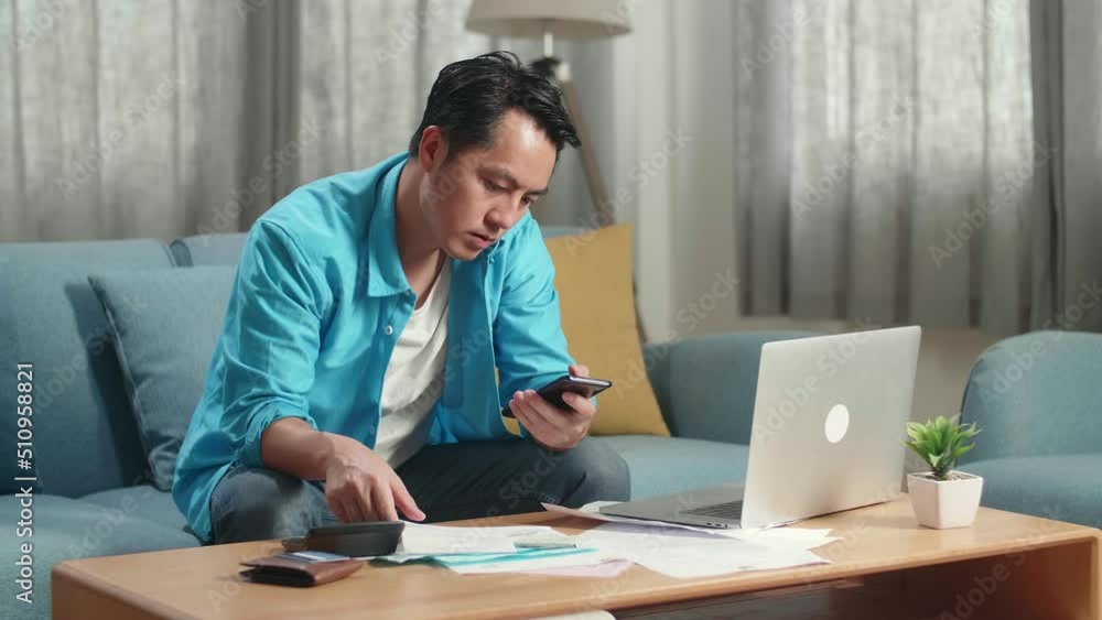 Asian Man With A Laptop Answering The Call And Having Headache While Looking At The Bill In Hand
Asian Man With A Laptop Answering The Call And Having Headache While Looking At The Bill In Hand