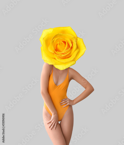Woman with yellow rose flow...
