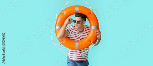 Beach rescuer holding lifeb...