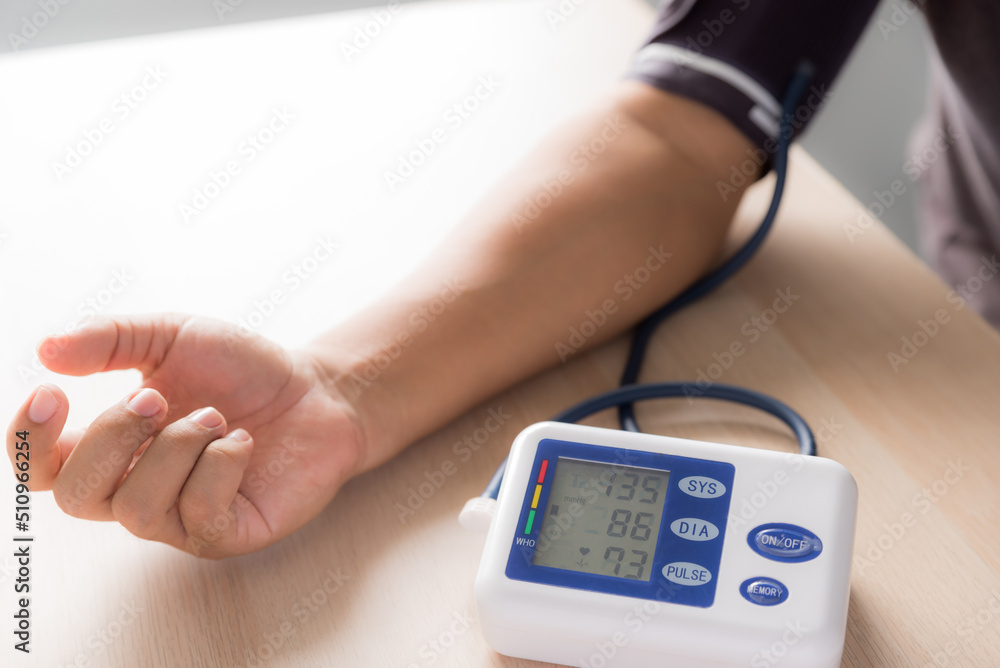 young man measured his blood pressure with a handheld device and found the pressure was higher than normal young man measured his blood pressure with a handheld device and found the pressure was higher than normal