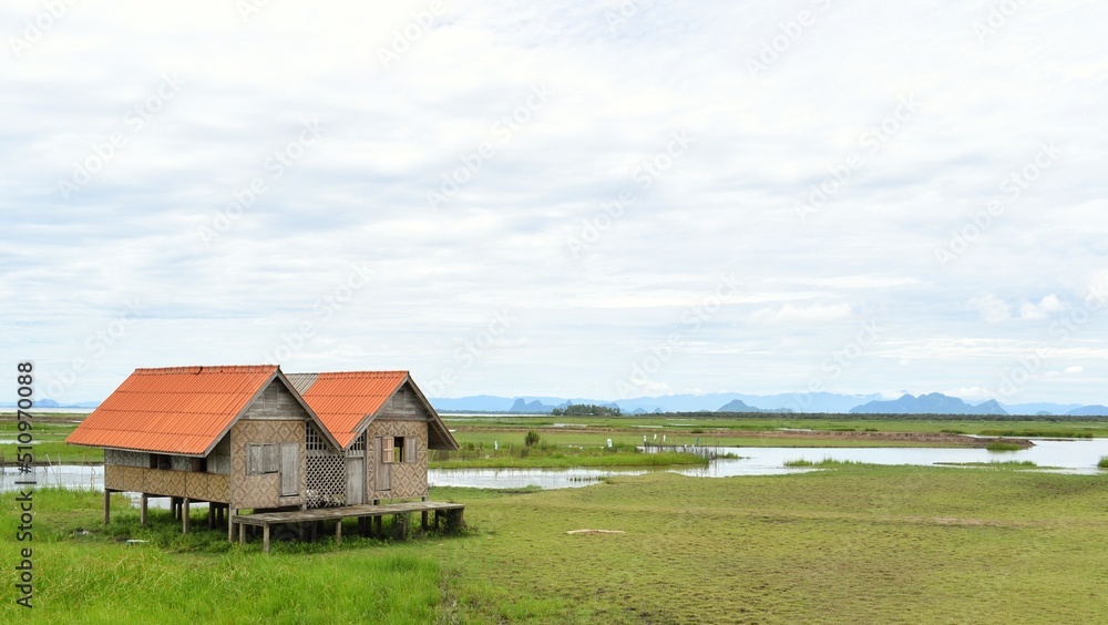 Abandoned house with orange roof located in Thale Noi area the part of Songkhla Lake, Phatthalung, THAILAND.
