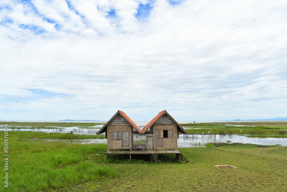 Abandoned house with orange roof located in Thale Noi area the part of Songkhla Lake, Phatthalung, THAILAND. Abandoned house with orange roof located in Thale Noi area the part of Songkhla Lake, Phatthalung, THAILAND.