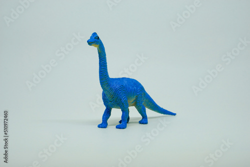 Side view of plastic Ultrasaurus dinosaur plastic toy for kids, isolated on a studio lighting background
