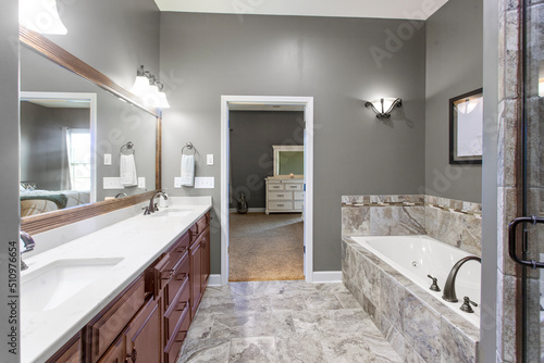 interior of bathroom with granite counter tops and mirror