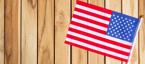 United States of America flag on wooden table background. USA holiday of Veterans, Memorial, Independence ( Fourth of July) and Labor Day concept