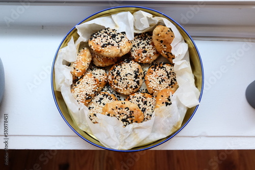 Turkish salted cookies with black sesame in box. It is called "Tuzlu Kurabiye", "Kuru Pasta", "Kandil Simidi" in Turkish. Homemade Pastry.