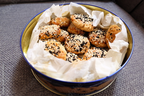 Turkish salted cookies with black sesame in box. It is called "Tuzlu Kurabiye", "Kuru Pasta", "Kandil Simidi" in Turkish. Homemade Pastry.
