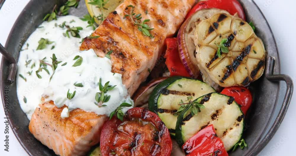 Grilled salmon and vegetables, Top view, rotation Grilled salmon and vegetables, Top view, rotation