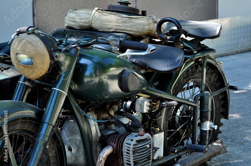 A motorcycle is usually a two—wheeled (less often — three-wheeled) vehicle with an engine.