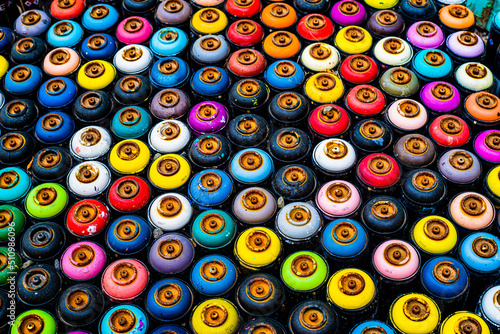 Colorful paint cans are arranged neatly