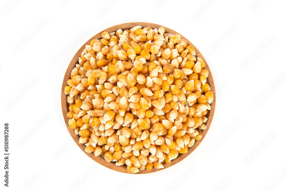 dry corn in plate isolated on white background.Unpopped popcorn dry corn in plate isolated on white background.Unpopped popcorn