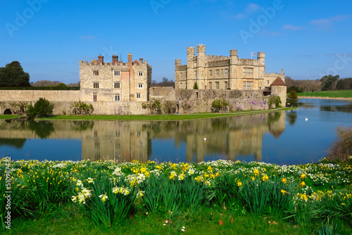 Defocused nature background. View of Leeds Castle in Kent, UK. Leeds Castle, England, reflection, spring sunny day, with flowers blooming.