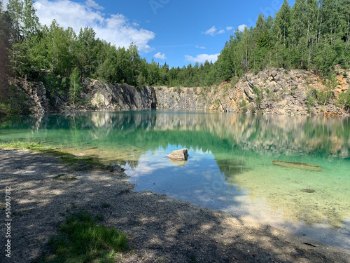 Old limestone quarry. Nature photography. Turquoise water, bathing area. Travel concept.