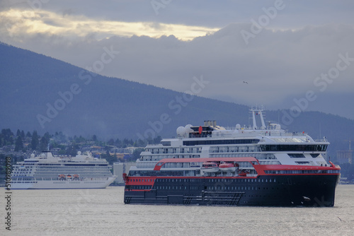 Hurtigruten expedition vessel cruiseship cruise ship liner Roald Amundsen arrival into Port of Vancouver, Canada during early morning sunrise twilight blue hour after Alaska cruising photo