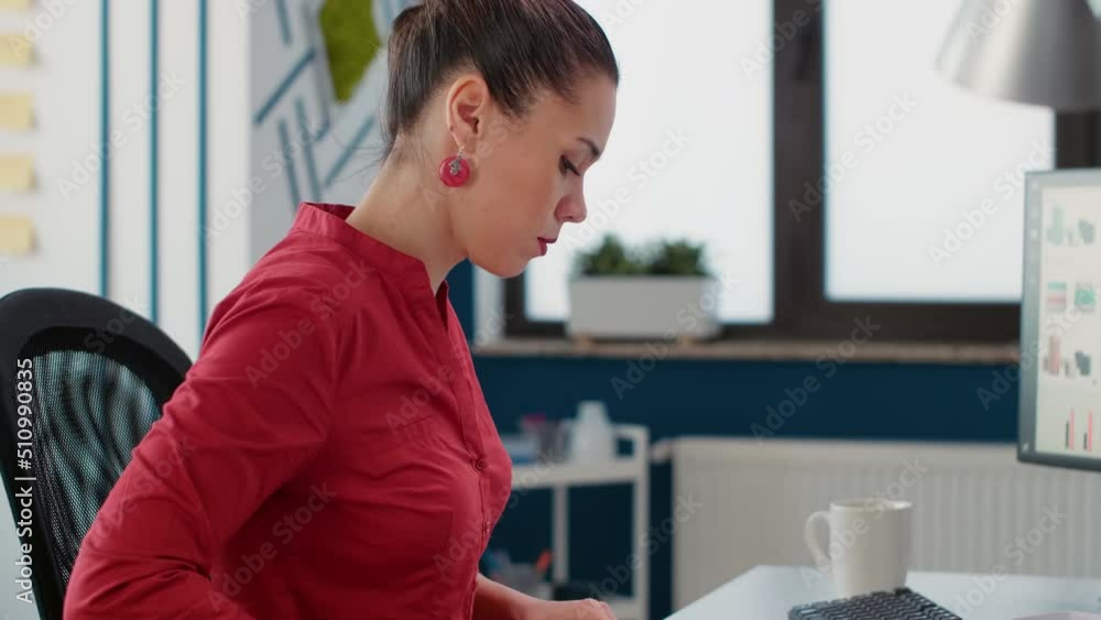 Female accountant taking notes on business documents to create financial report on computer. Company assistant analyzing commercial charts with data, doing research for development strategy. Female accountant taking notes on business documents to create financial report on computer. Company assistant analyzing commercial charts with data, doing research for development strategy.